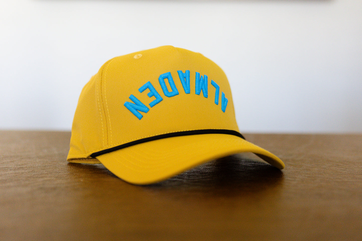 Almaden Dijon Rope hat With Blue Neon lettering